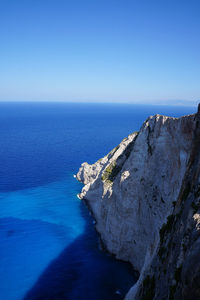 Scenic view of sea against clear blue sky