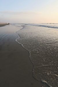 Scenic view of beach against sky during sunset