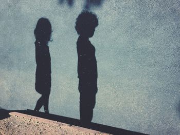 High angle view of children shadow on street