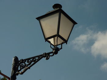 Low angle view of street light against sky