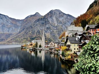 Panoramic view of buildings and mountains against sky