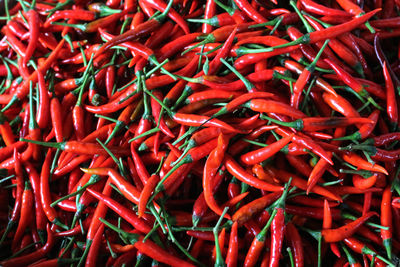 Full frame shot of red chili peppers for sale at market