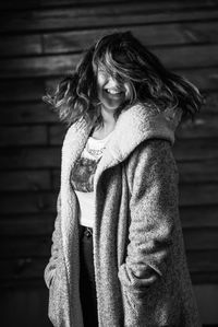 Midsection of woman wearing hat while standing outdoors