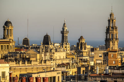 Cityscape against sky during sunset