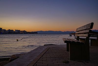 Scenic view of sea against clear sky at sunset