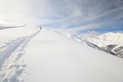 Scenic view of snowcapped mountains against sky