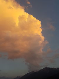 Low angle view of mountain against sky during sunset