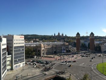 High angle view of buildings in city against clear sky