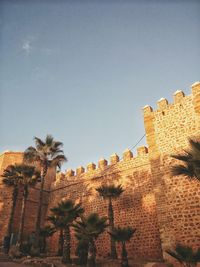 Low angle view of old building against clear sky