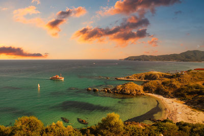 High angle view of bay against sky during sunset