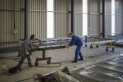 Factory worker in truck manufacture assembling truck parts