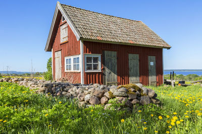 House on field against sky