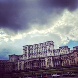 Low angle view of building against cloudy sky