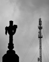 Low angle view of communications tower against sky