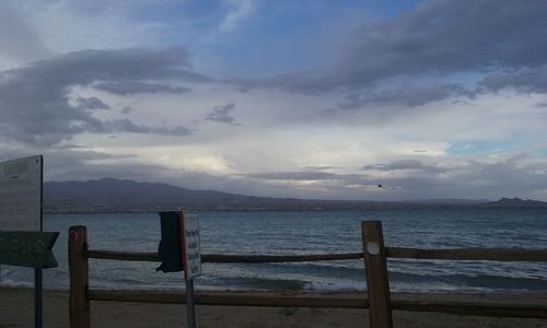 Scenic view of sea against cloudy sky