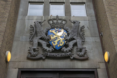 Low angle view of statue against building