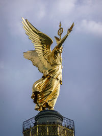 Low angle view of statue against sky