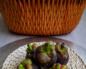 High angle view of fruits in basket on table