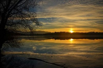 Scenic view of lake at sunset