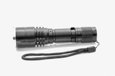 Close-up of camera over white background