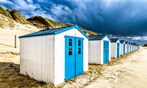 Beach huts against sky