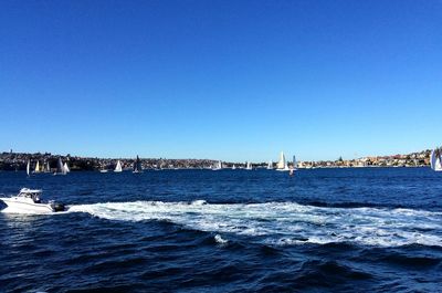 Scenic view of sea against clear blue sky