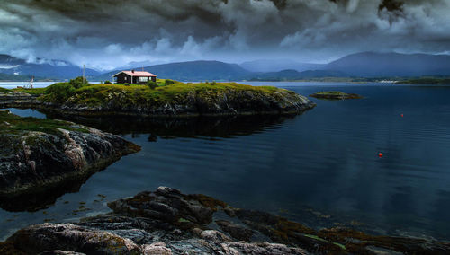 Scenic view of sea against cloudy sky