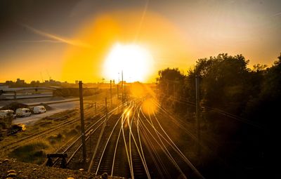 High angle view of railroad tracks against sky during sunset