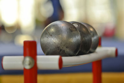 Close-up of balls on rack