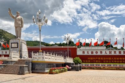 Statue of building against cloudy sky