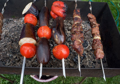 High angle view of strawberries on barbecue grill