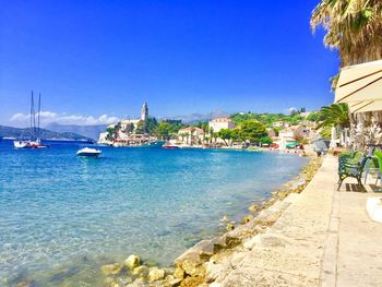 Scenic view of sea against blue sky