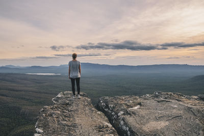 Woman stands at the balconies admiring the vast landscape, grampians national park, victoria, australia