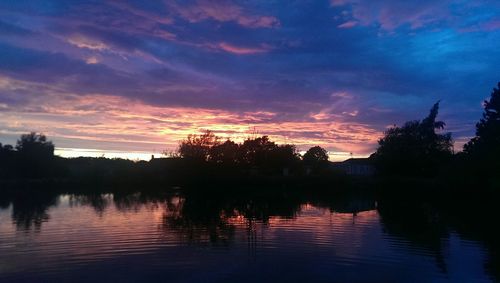 Scenic view of lake at sunset