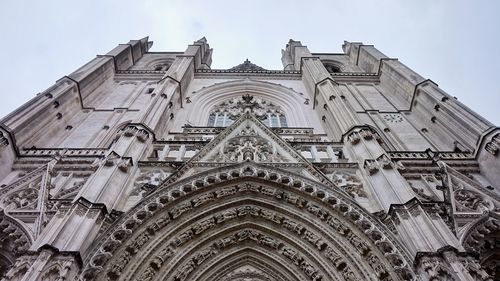 Low angle view of ornate building against sky