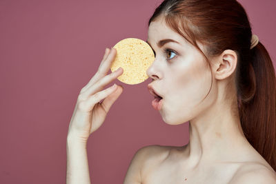 Portrait of woman eating food