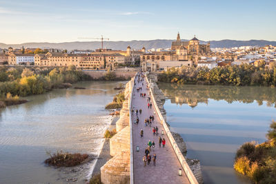 High angle view of river amidst buildings in city