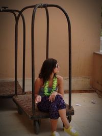 Young woman sitting on stage