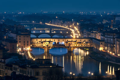 High angle view of illuminated ponte vecchio over arno river