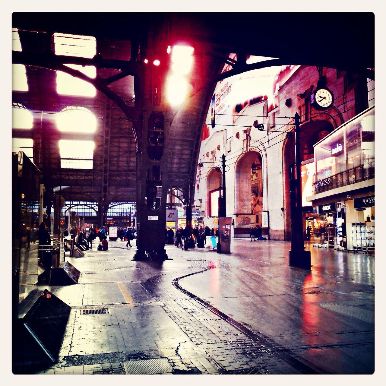 transfer print, architecture, built structure, auto post production filter, indoors, building exterior, transportation, illuminated, incidental people, city, arch, architectural column, travel, railroad station, city life, person, the way forward, street, travel destinations, public transportation