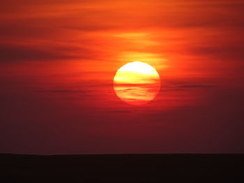 Scenic view of silhouette landscape against romantic sky at sunset