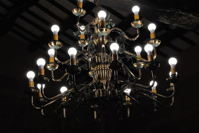 Low angle view of illuminated lighting equipment