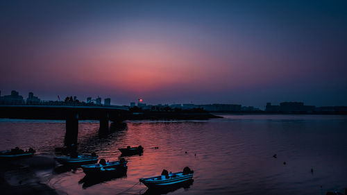 Scenic view of river against sky during sunset