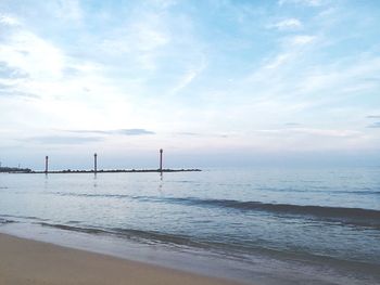 Scenic view of sea against cloudy sky