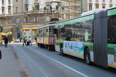 People on road in city