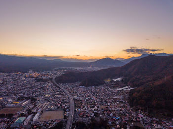 High angle view of townscape against sky during sunset