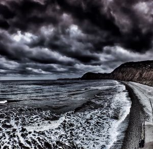 Scenic view of sea against cloudy sky