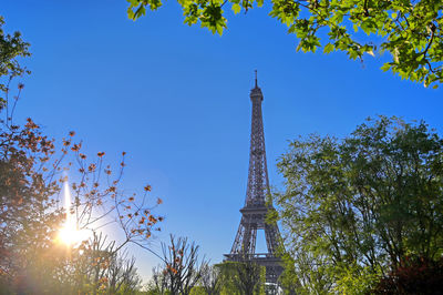 Low angle view of tower against blue sky