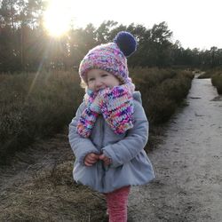 Cute smiling girl standing on road