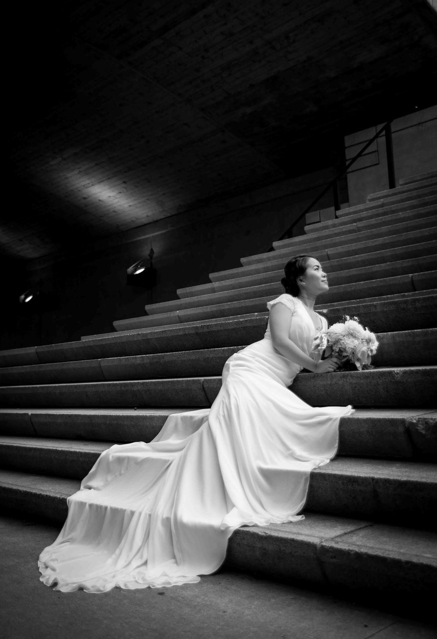 sitting, full length, tradition, life events, wedding, bride, adults only, spirituality, one person, wedding dress, skill, celebration, dedication, flower, people, indoors, one woman only, performance, bouquet, adult, young adult, day